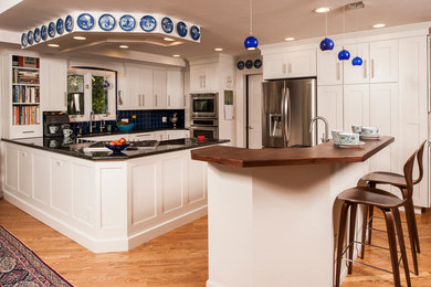 Example of a transitional kitchen design in Denver