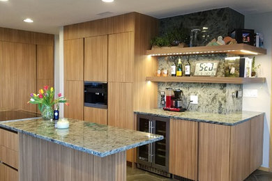 Inspiration for a medium sized contemporary u-shaped kitchen/diner with a double-bowl sink, medium wood cabinets, granite worktops, green splashback, stone slab splashback, stainless steel appliances, porcelain flooring, an island, grey floors and green worktops.