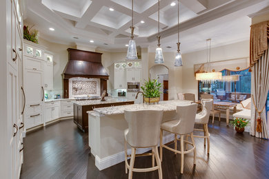 Inspiration for a mid-sized contemporary single-wall dark wood floor eat-in kitchen remodel in Tampa with shaker cabinets, white cabinets, granite countertops, beige backsplash, porcelain backsplash, paneled appliances and two islands
