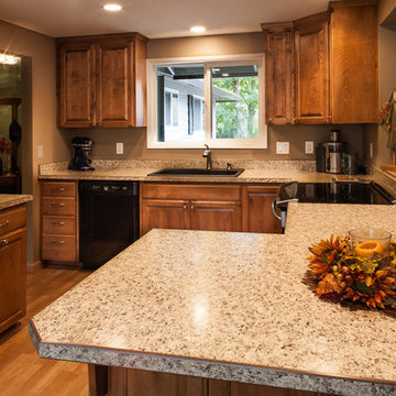 Laminate Countertops, Black Appliances, Birch Cabinets