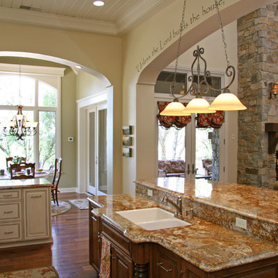 Inspiration for a timeless open concept kitchen remodel in Sacramento with a double-bowl sink, raised-panel cabinets and beige cabinets