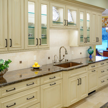 Large Countertop and Raised Panel Cabinetry in Traditional Kitchen