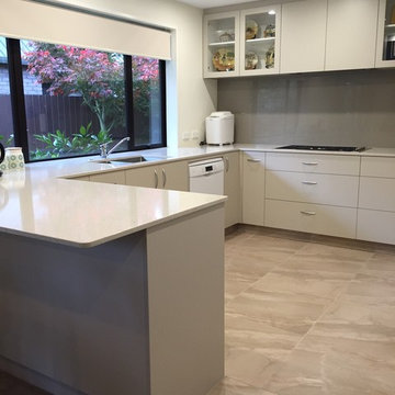 Large u-shaped kitchen with Eurostone Beige benchtops