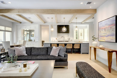 Example of a classic kitchen design in Austin with shaker cabinets and an island