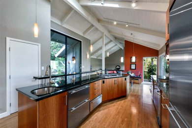 Inspiration for a mid-sized contemporary l-shaped medium tone wood floor, brown floor, exposed beam, vaulted ceiling and wood ceiling eat-in kitchen remodel in San Francisco with an undermount sink, flat-panel cabinets, dark wood cabinets, granite countertops, glass sheet backsplash, stainless steel appliances, an island and black countertops