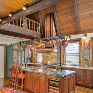 Large traditional open concept kitchen photos - Inspiration for a large timeless l-shaped medium tone wood floor open concept kitchen remodel in Kansas City with a double-bowl sink, medium tone wood cabinets, granite countertops, brown backsplash, stone slab backsplash, colored appliances, an island and recessed-panel cabinets