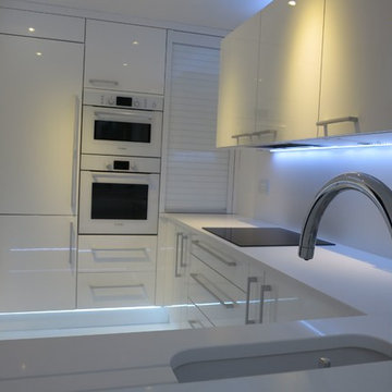 LED lit all white minimal kitchen