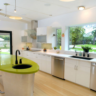 Kitchen - eclectic kitchen idea in Houston with stainless steel appliances, an undermount sink, flat-panel cabinets, white cabinets, quartz countertops and green countertops