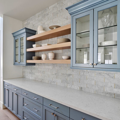 Inspiration for a large country light wood floor and beige floor open concept kitchen remodel in Phoenix with a farmhouse sink, white cabinets, quartz countertops, gray backsplash, marble backsplash, paneled appliances, an island, gray countertops and shaker cabinets