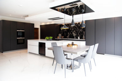 Expansive contemporary kitchen in London with an island.