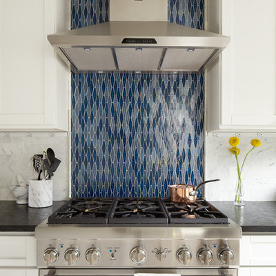 Example of a mid-sized classic light wood floor eat-in kitchen design in Seattle with blue backsplash, stainless steel appliances, an undermount sink, shaker cabinets, white cabinets, onyx countertops, stone tile backsplash and no island