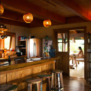 Tropical kitchen designs - Kitchen - tropical kitchen idea in Hawaii with wood countertops and stainless steel appliances