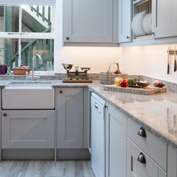 Light Grey Shaker style U shape fitted kitchen with Amrbosia White Granite