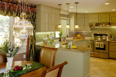 Example of a mid-sized transitional u-shaped porcelain tile eat-in kitchen design in Denver with green cabinets, granite countertops, multicolored backsplash, glass tile backsplash and stainless steel appliances