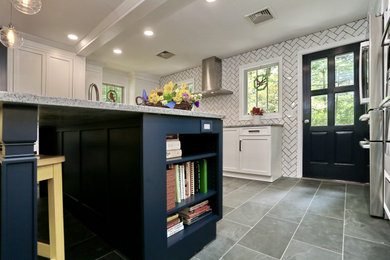 Mid-sized transitional u-shaped slate floor and gray floor eat-in kitchen photo in Boston with an undermount sink, shaker cabinets, blue cabinets, granite countertops, white backsplash, porcelain backsplash, stainless steel appliances, an island and gray countertops