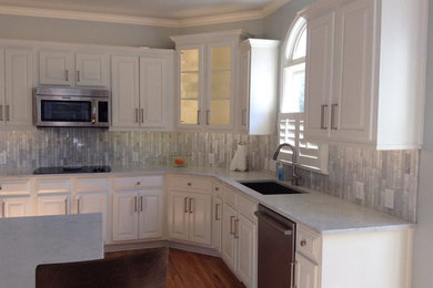 Linear Carrara on a vertical lay complimenting a Quartz counter top