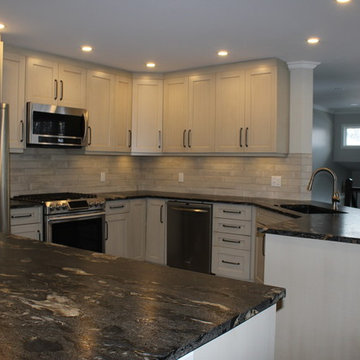 Linen kitchen with leathered granite island and countertops