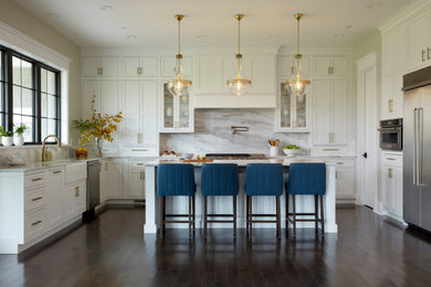 Kitchen - transitional u-shaped dark wood floor and brown floor kitchen idea in DC Metro with a farmhouse sink, shaker cabinets, white cabinets, marble countertops, gray backsplash, marble backsplash, stainless steel appliances, an island and gray countertops