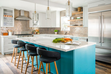 Mid-sized transitional l-shaped porcelain tile and brown floor eat-in kitchen photo in Houston with an undermount sink, shaker cabinets, gray cabinets, metallic backsplash, metal backsplash, stainless steel appliances, an island and white countertops