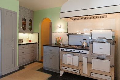 Linoleum flooring and a vintage Magic Chef 6300 stove set the stage for the kitc