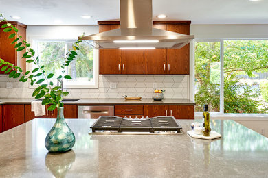 Inspiration for a mid-sized contemporary l-shaped medium tone wood floor and beige floor eat-in kitchen remodel in Other with a double-bowl sink, flat-panel cabinets, dark wood cabinets, quartz countertops, white backsplash, ceramic backsplash, stainless steel appliances, an island and gray countertops