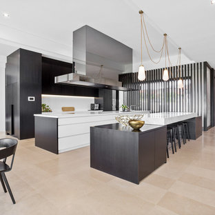 Design ideas for a contemporary galley eat-in kitchen in Perth with flat-panel cabinets, black cabinets, white splashback, multiple islands and beige floor.