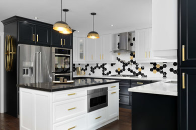Kitchen - transitional u-shaped dark wood floor and brown floor kitchen idea in Toronto with a double-bowl sink, beaded inset cabinets, black cabinets, multicolored backsplash, stainless steel appliances, an island and black countertops
