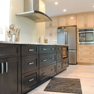 Mid-sized asian eat-in kitchen ideas - Mid-sized asian single-wall light wood floor eat-in kitchen photo in Cleveland with a single-bowl sink, shaker cabinets, dark wood cabinets, granite countertops, white backsplash, subway tile backsplash, stainless steel appliances and an island
