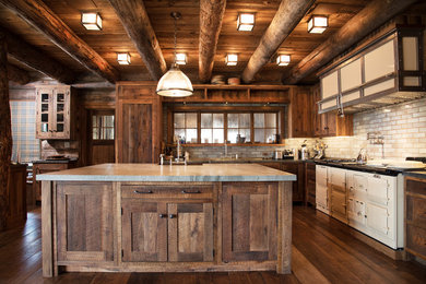 Mountain style l-shaped dark wood floor and brown floor kitchen photo in New York with shaker cabinets, dark wood cabinets, gray backsplash, subway tile backsplash, white appliances and an island