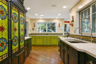 Inspiration for a large timeless galley medium tone wood floor and brown floor kitchen remodel in San Francisco with an undermount sink, recessed-panel cabinets, green cabinets, multicolored backsplash, paneled appliances, no island, quartz countertops and ceramic backsplash