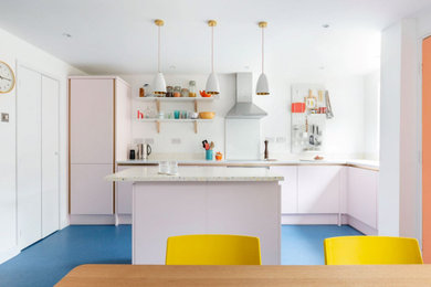 Inspiration for a small contemporary l-shaped kitchen/diner in London with a single-bowl sink, flat-panel cabinets, terrazzo worktops, multi-coloured splashback, integrated appliances, laminate floors, an island, blue floors and multicoloured worktops.