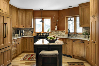 Large mountain style u-shaped medium tone wood floor open concept kitchen photo in Burlington with recessed-panel cabinets, medium tone wood cabinets, an island, an undermount sink and paneled appliances