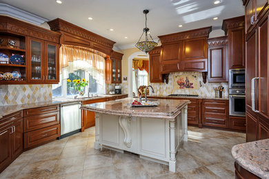 Example of a mid-sized transitional u-shaped ceramic tile and beige floor enclosed kitchen design in San Francisco with an undermount sink, medium tone wood cabinets, multicolored backsplash, stainless steel appliances, raised-panel cabinets, granite countertops, ceramic backsplash and an island