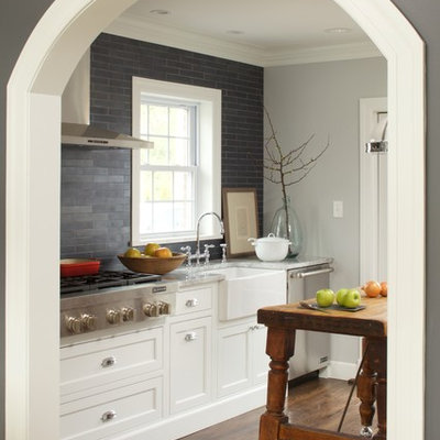Kitchen - transitional kitchen idea in New York with a farmhouse sink, beaded inset cabinets, white cabinets, gray backsplash and slate backsplash
