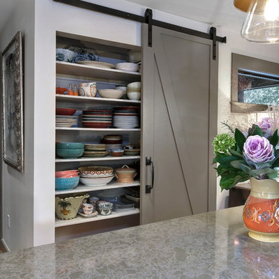 Example of a mid-sized transitional kitchen design in Charleston with gray cabinets, recessed-panel cabinets and an island
