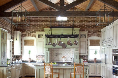 Inspiration for a huge transitional u-shaped medium tone wood floor open concept kitchen remodel in Charleston with a farmhouse sink, recessed-panel cabinets, distressed cabinets, granite countertops, beige backsplash, ceramic backsplash, stainless steel appliances and an island