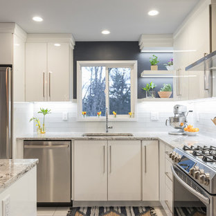 Design ideas for a mid-sized scandinavian l-shaped eat-in kitchen in Manchester with an undermount sink, flat-panel cabinets, white cabinets, quartz benchtops, multi-coloured splashback, glass sheet splashback, stainless steel appliances, plywood floors and with island.