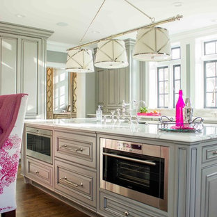 Huge shabby-chic style open concept kitchen remodeling - Huge cottage chic u-shaped dark wood floor open concept kitchen photo in Cedar Rapids with an undermount sink, gray cabinets, marble countertops, white backsplash, stainless steel appliances, two islands and recessed-panel cabinets