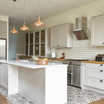 Luxury bespoke kitchen with tiled floor & walls