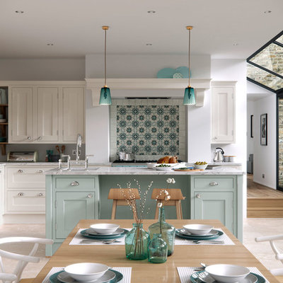 Inspiration for a large farmhouse l-shaped light wood floor open concept kitchen remodel in Manchester with shaker cabinets, marble countertops, an island and blue cabinets