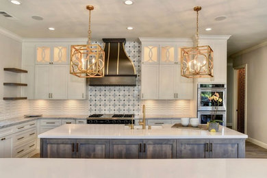 Large transitional l-shaped eat-in kitchen photo in Sacramento with two islands