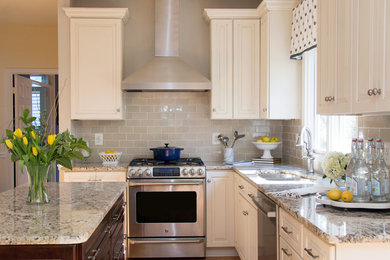 Mid-sized transitional u-shaped light wood floor eat-in kitchen photo in DC Metro with a double-bowl sink, raised-panel cabinets, white cabinets, granite countertops, gray backsplash, terra-cotta backsplash, stainless steel appliances and an island