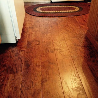 Photo of an eat-in kitchen in Chicago with vinyl floors.