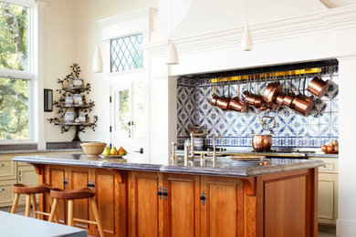 Inspiration for a timeless eat-in kitchen remodel in San Francisco with medium tone wood cabinets and multicolored backsplash