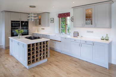 Classic open plan kitchen in Other with an island.