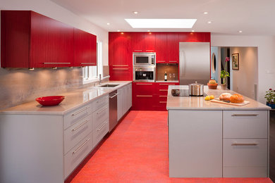 Inspiration for a modern l-shaped eat-in kitchen remodel in New York with an undermount sink, flat-panel cabinets, red cabinets and an island
