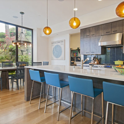 Trendy eat-in kitchen photo in Seattle with an undermount sink, flat-panel cabinets, dark wood cabinets and blue backsplash