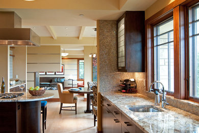 Example of a large trendy l-shaped light wood floor eat-in kitchen design in Minneapolis with an undermount sink, flat-panel cabinets, dark wood cabinets, granite countertops, metallic backsplash, mosaic tile backsplash, stainless steel appliances and an island