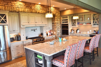 Kitchen - farmhouse light wood floor kitchen idea in Louisville with a farmhouse sink, white cabinets, granite countertops, white backsplash, stainless steel appliances and an island