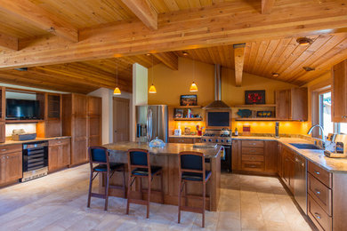 Large mountain style kitchen photo in Portland with an undermount sink, shaker cabinets, medium tone wood cabinets, stainless steel appliances and an island